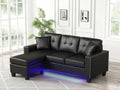 89343 Sorenza black faux leather reversible chaise 74" wide sectional sofa with under sofa LED lighting USB charging nail head trim